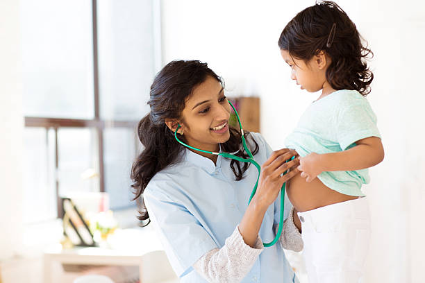 Doctor examining child